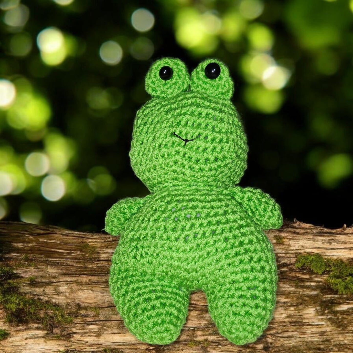 Handmade crochet frog plushie displayed against a neutral background.