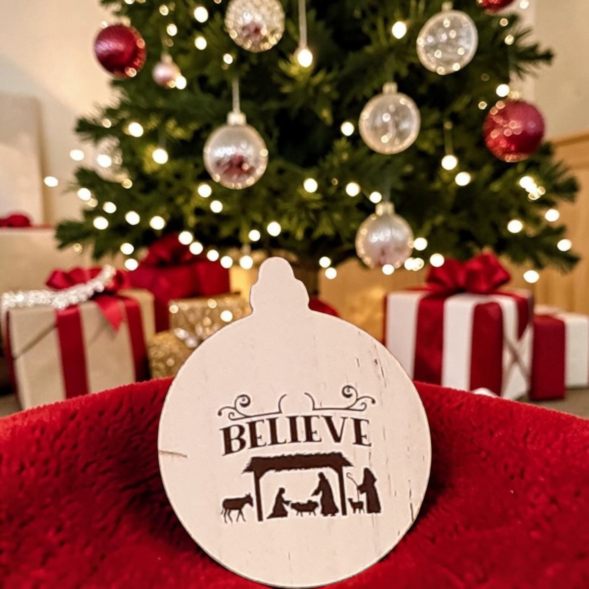 Believe Nativity wood Christmas ornament with Mary Joseph and Baby Jesus manger scene