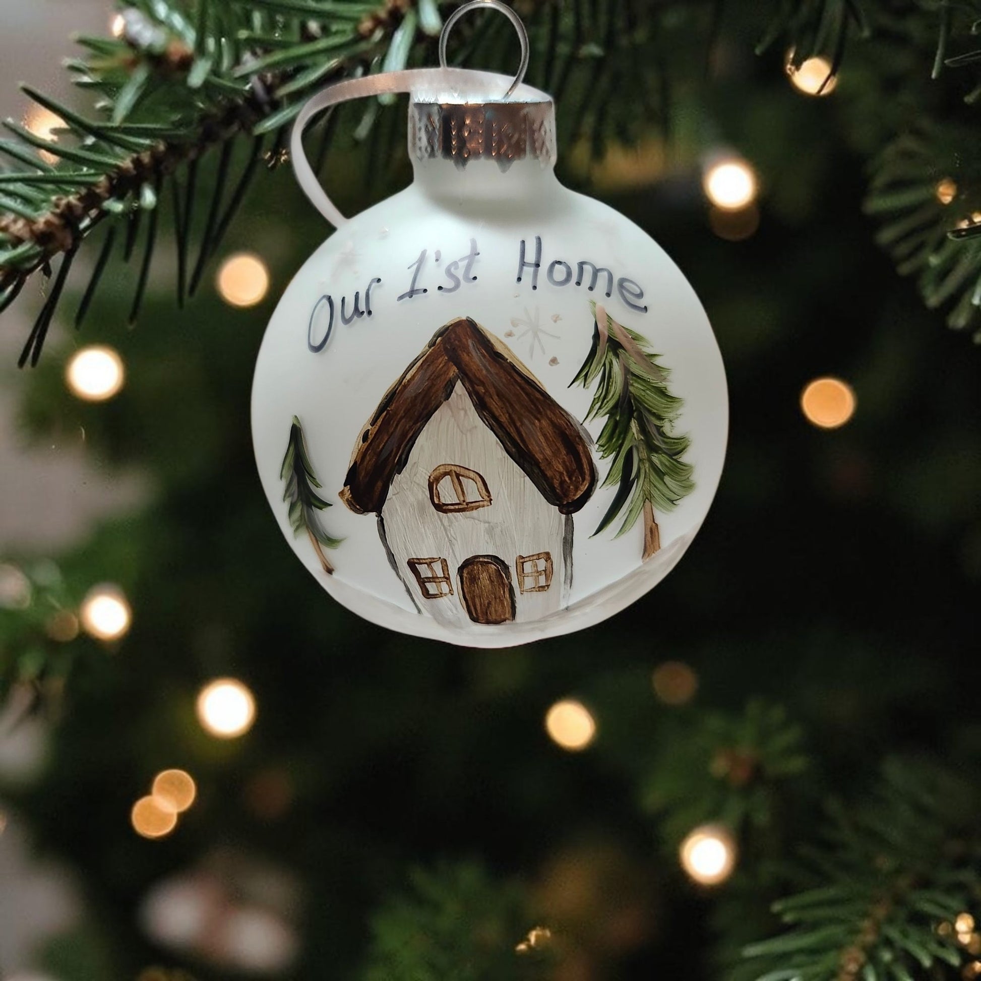 Hand-painted Our 1st Home glass Christmas ornament with house and snowy winter scene