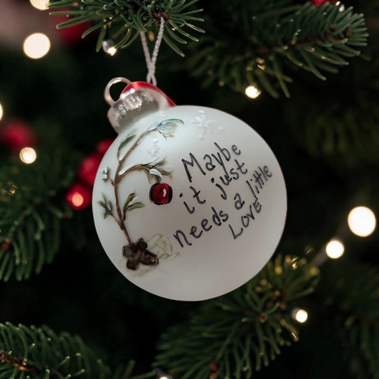 Handpainted glass Christmas ornament with snowy branch, red ornament and Maybe It Just Needs a Little Love message